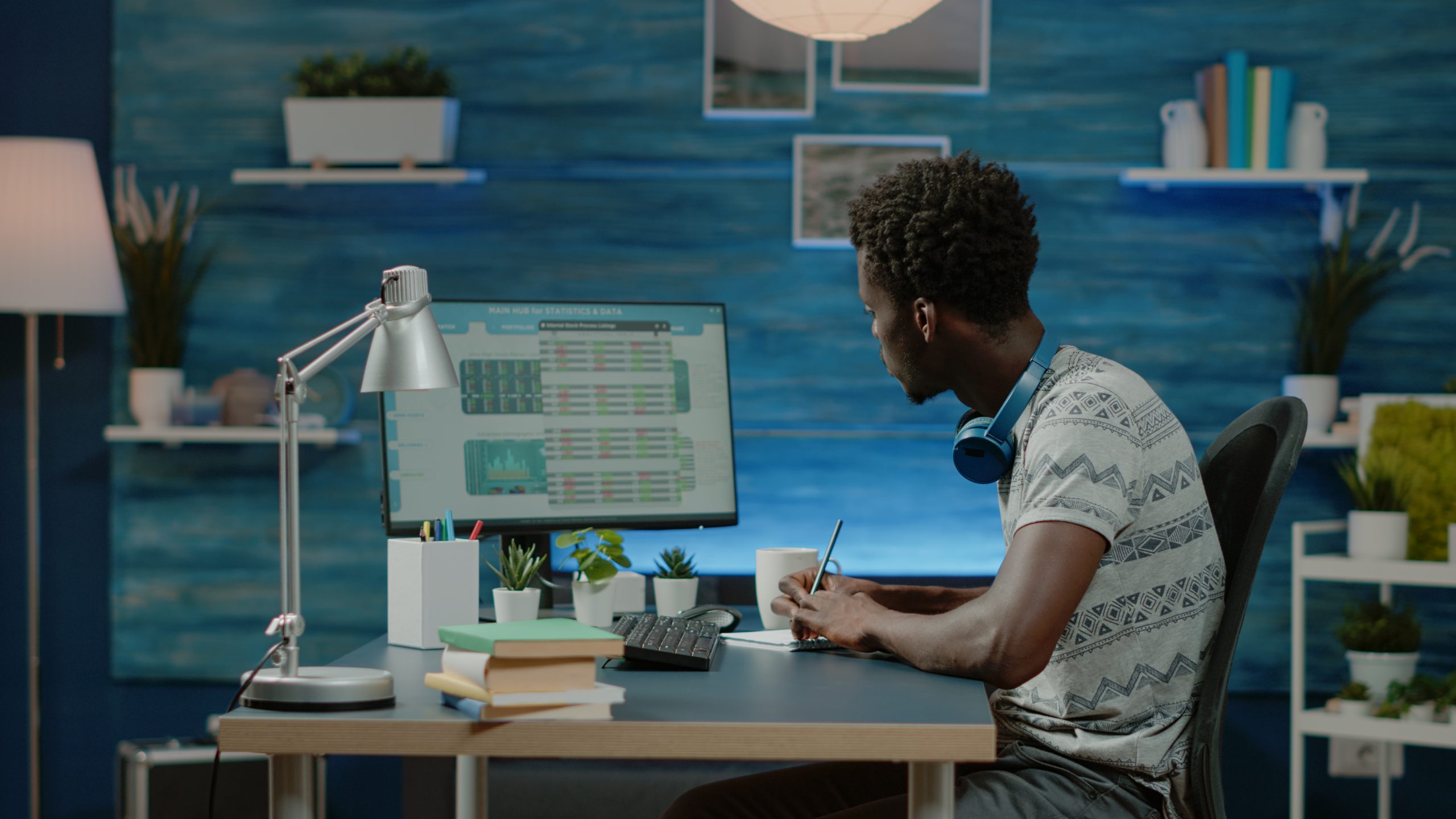 Black man looking at stock market exchange information